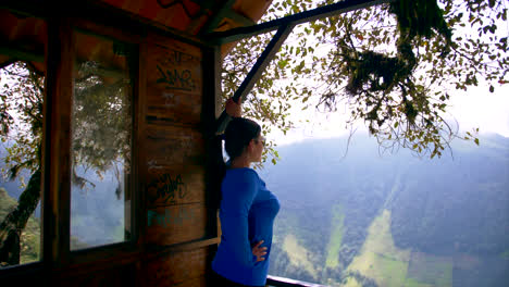 woman in blue clothes look at the horizon