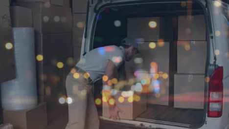 animation of traffic lights over man loading cardboard boxes into van