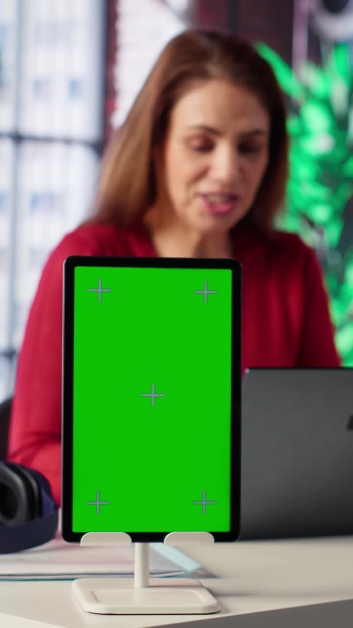 Vertical Video Woman organizing and planning activities on the agenda next to chroma key