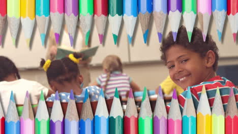 animation of coloured pencils over diverse school children and female teacher