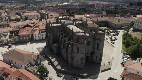 an aerial view of a monumental medieval jewel - guarda cathedral in portugal