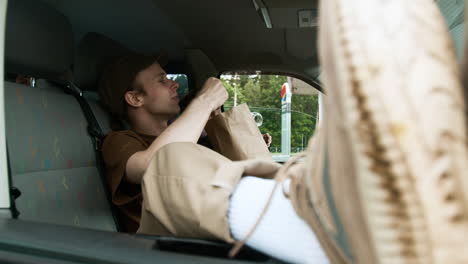 friends eating snacks and drinking in the van