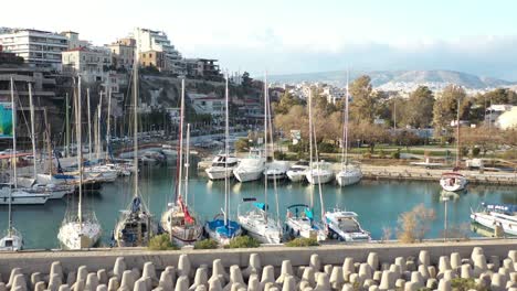 Forward-tilt-down-aerial-shot-on-the-tetra-pod-breakwater-with-the-beautiful-sailboat-and-yachts-on-it