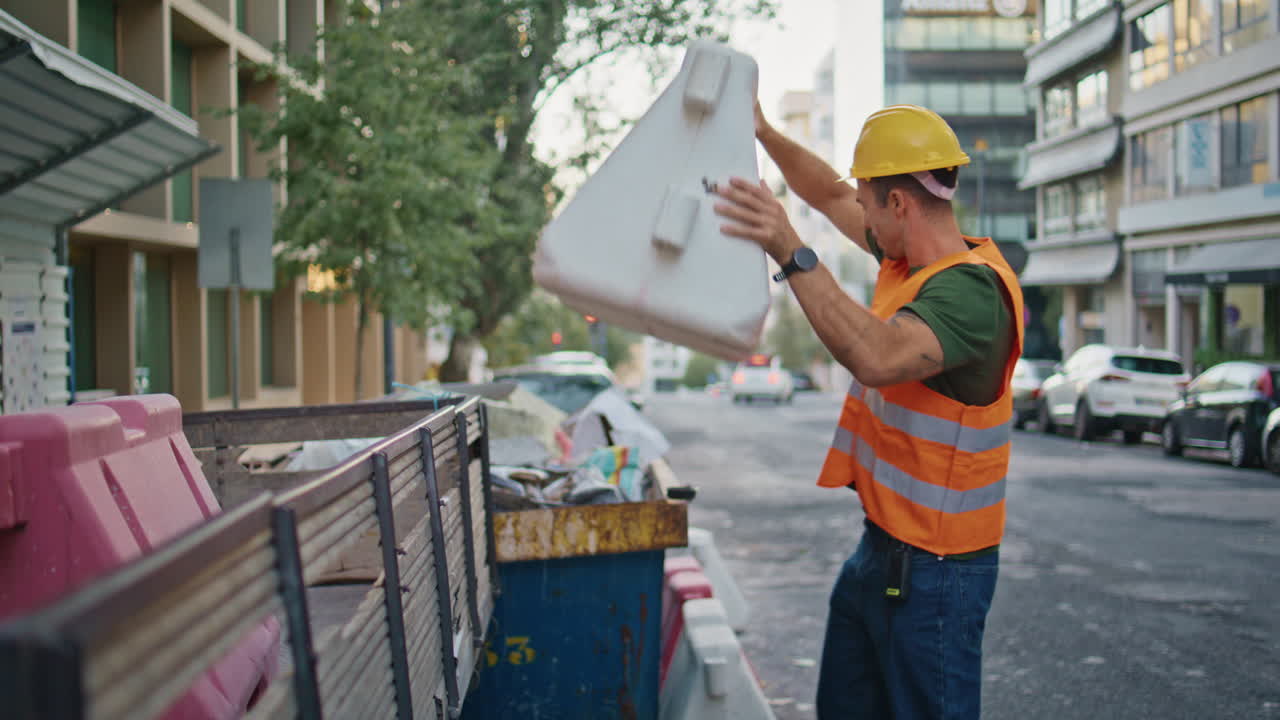 Uniform worker cleaning city. Hardhat urban cleaner in vest throw away rubbish