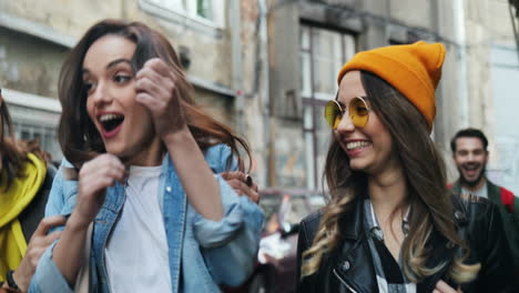 close-up view of young caucasian friends walking down the street