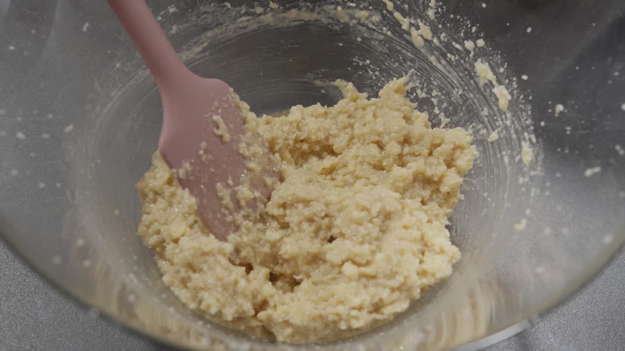 Mixing Cookie Dough with Spatula in Glass Bowl Close Up