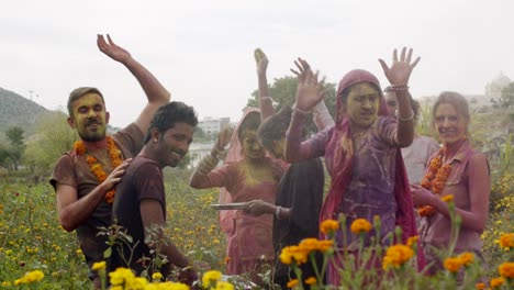 multi ethnic people celebrating the festival of colors holi in india