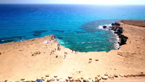 crystal clear turquoise blue water at sea caves ayia napa cyprus view