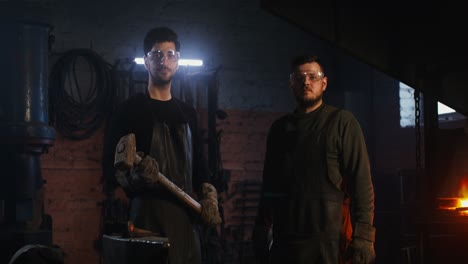 two blacksmiths in a workshop