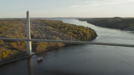 cars driving across penobscot narrows bridge autumn sunset aerial pull back