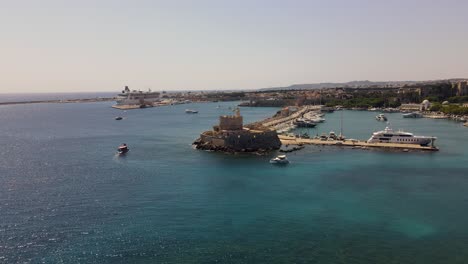 drone shot of mandraki rhodes marina and the saint nicholas fortress on the island of rhodos, greece