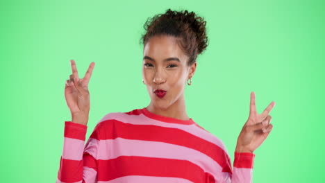 a cheerful woman making a peace sign