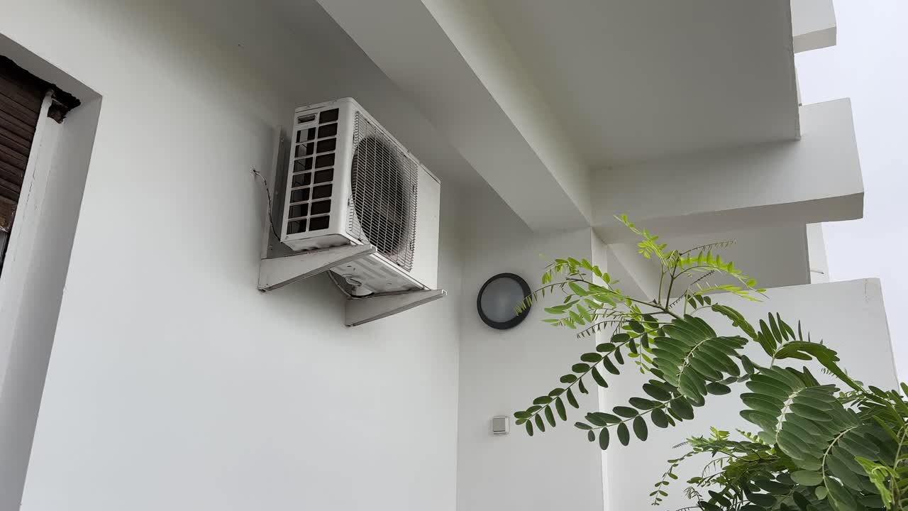 Air conditioning unit on hotel balcony exterior building Morocco North Africa cooling system