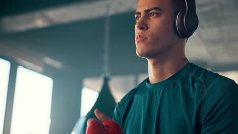 Kickboxing,-music-and-fitness-with-a-man-listening