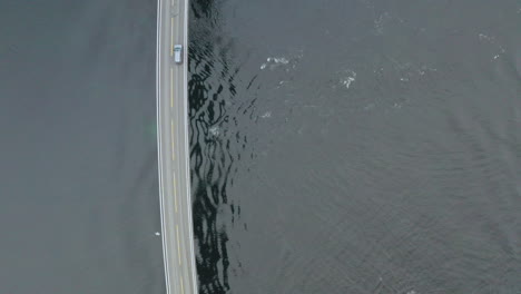 car crossing famous storseisund bridge at atlanterhavsvegen in more and romsdal, norway