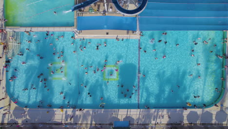 top down view of children enjoying the pools during the summer