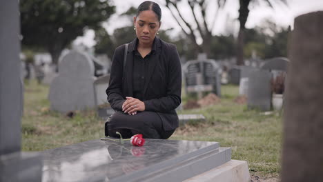 sad woman, graveyard and rose on tombstone