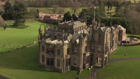 parallax-drone-shot-of-castle-mansion-on-sunny-day