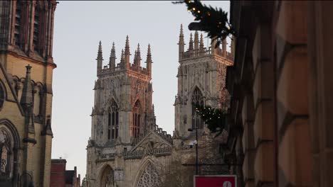 Foreground-reveal-in-slow-motion-of-one-of-the-towers-of-huge-cathedral-during-clear-sunrise