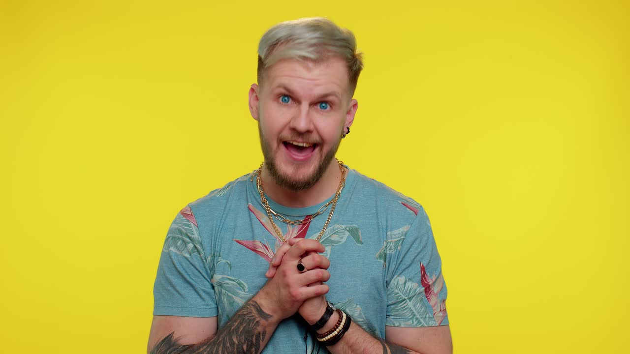 Lovely cheerful man greatly approves your suggestion, shaking head approvely, satisfied with work