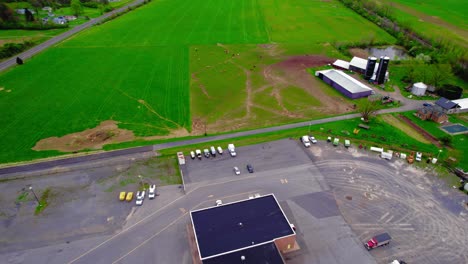 Establishing-aerial-of-cattle-farm-peacefully-grazing-in-lush,-green-Howard-PA-fields