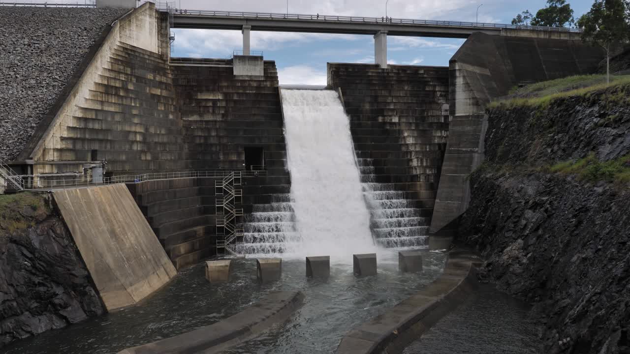 View of water flowing through the Hinze Dam overflow due to ongoing heavy rains in the Gold Coast Hinterland