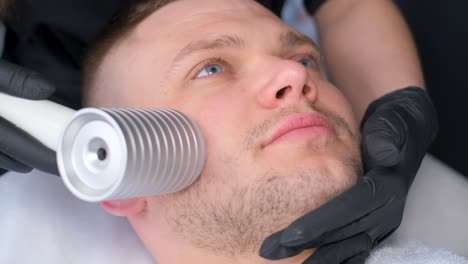 man receiving facial treatment