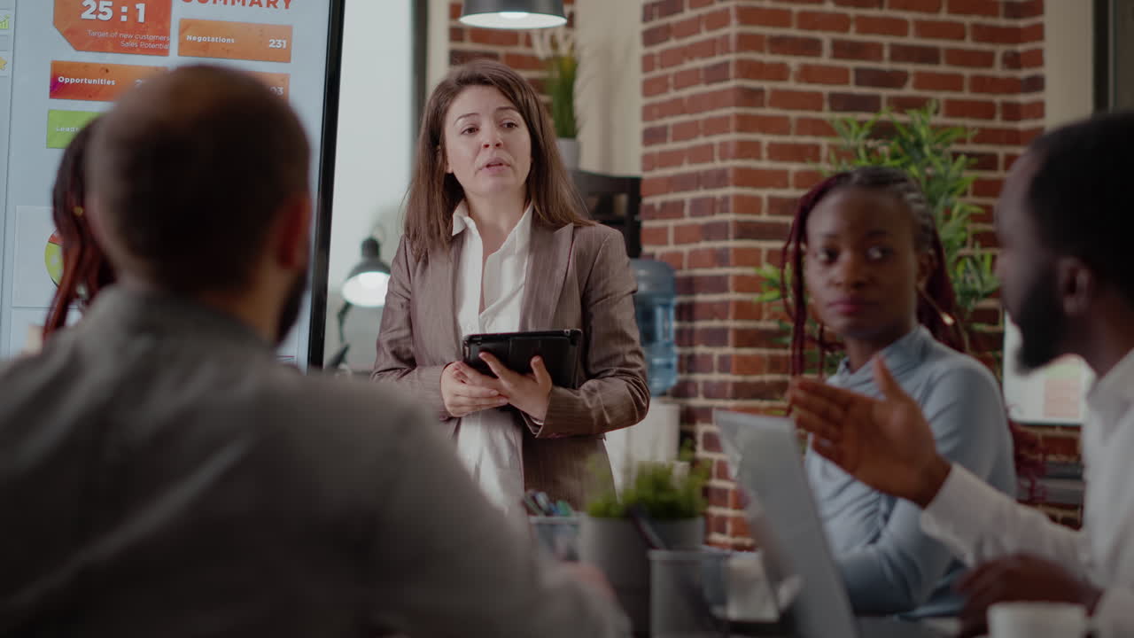 Business woman giving speech about marketing strategy