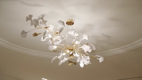 a beautiful glass chandelier with petals in a beautiful interior