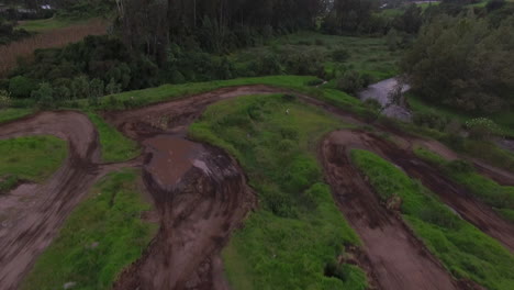 Drone-follows-dirt-tracks-revealing-beautiful-lush-landscape