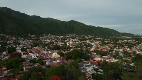 aerial view over ajijic town in jalisco, mexico. drone shot, dolly in