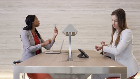 Beautiful-Smart-Business-woman-working-on-digital-table-in-lobby