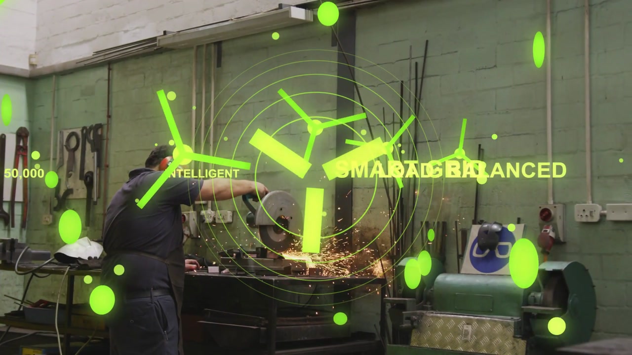 Machinist pressing metal to grinder, sparks flying while green AR growing, showing SMART GRID