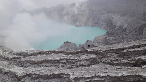 Person-on-Mount-Ijen-Volcano-Lake-in-East-Java,-Indonesia---Aerial