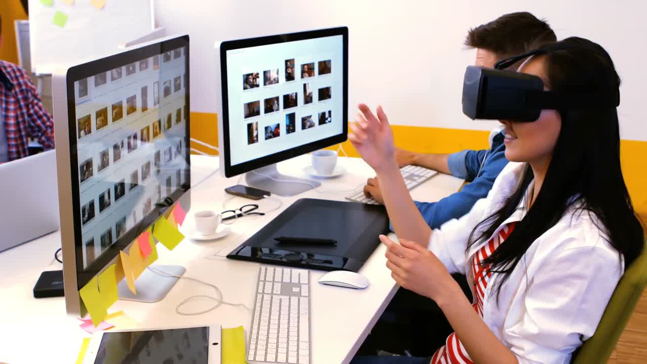 Graphic designers using virtual reality headset
