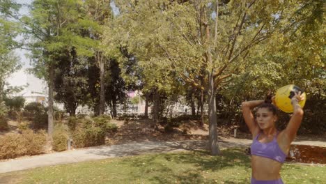 women playing with a ball in the park