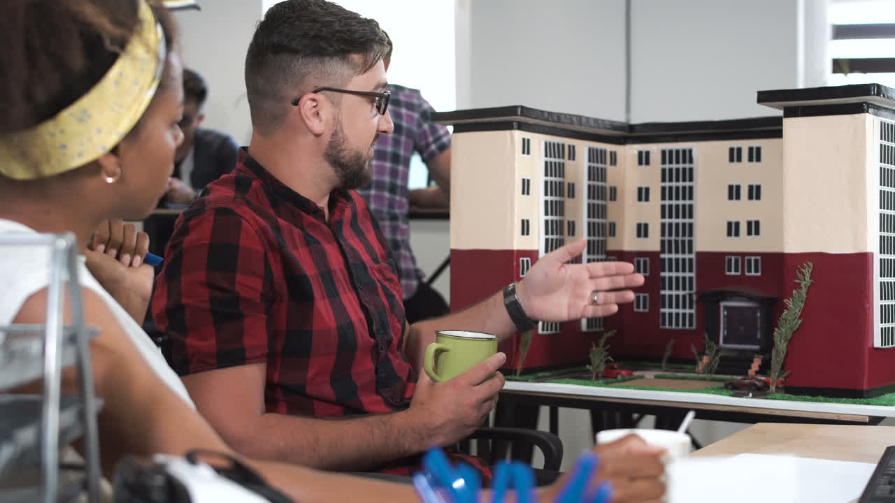 People looking at building model