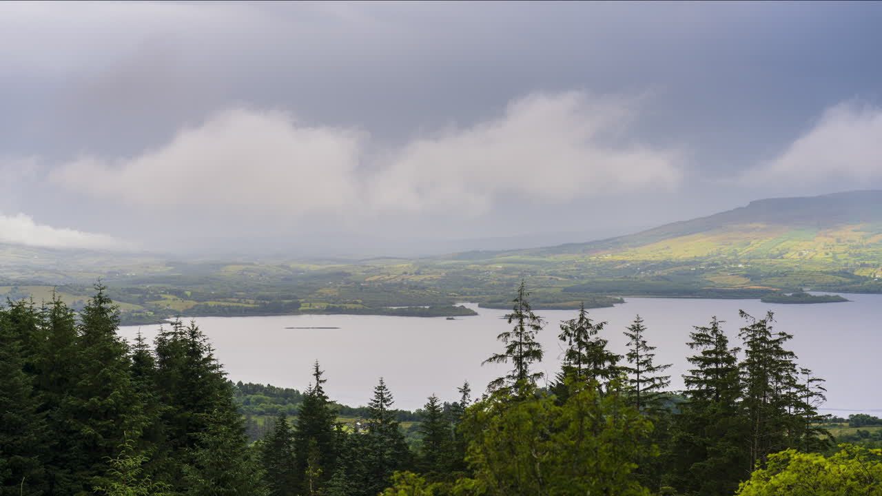 Time lapse of rural landscape with hills and lake in the distance on a sunny cloudy day in Arigna mountains in county Leitrim in Ireland