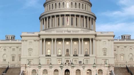 The-Camera-Pans-Up-The-Us-Capitol-Building-In-Washington-Dc-From-Ground-Level-To-Its-Landmark-Rotunda-And-Dome