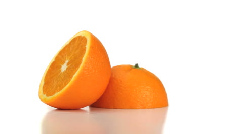 two halves of an orange turning