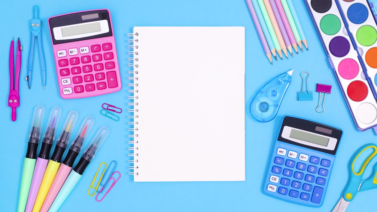 Open notebook for text appear in the middle of ordered Back to school accessories on blue theme. Stop motion