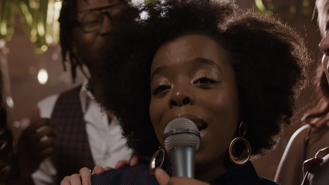 People singing and celebrating at a party