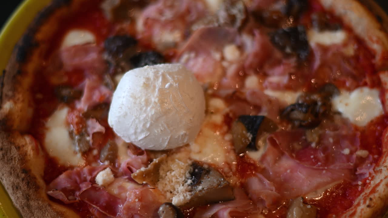 Top down shot of italian pizza with Burrata cheese