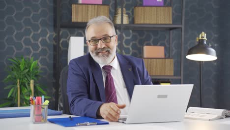 Cheerful-and-caring-businessman-looking-at-camera.