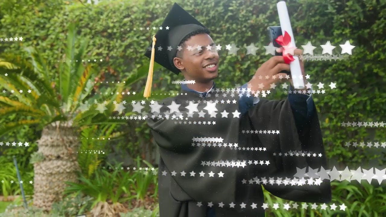 Graduate man lifting phone for selfie, marking graduation, star overlay highlighting diploma ribbon