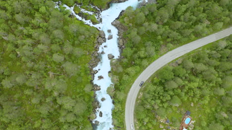 vehicles traveling at trollstigen road with a view of gudbrandsjuvet gorge in valldalen valley, norway