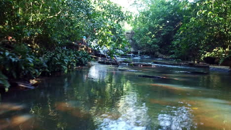 Aerial-shot-view-floating-over-small-river-in-the-jungle