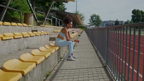 woman resting in a stadium