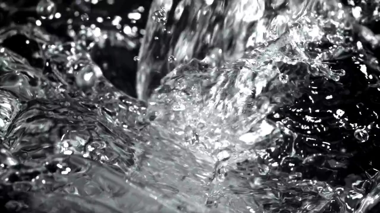 Clear Water Pouring and Splashing in Slow Motion on Black Background