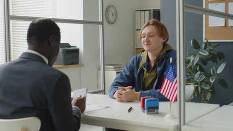 young man visiting u.s. embassy for visa interview